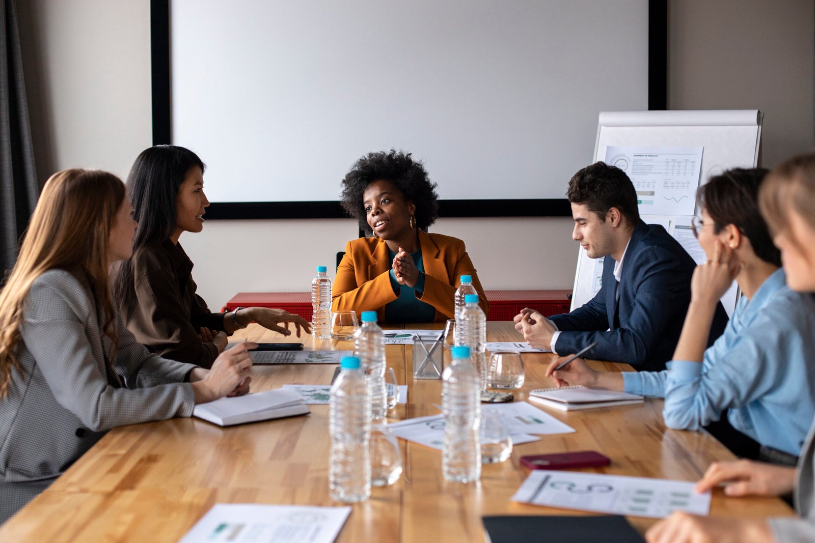 close-up-colleagues-chatting-table-image
